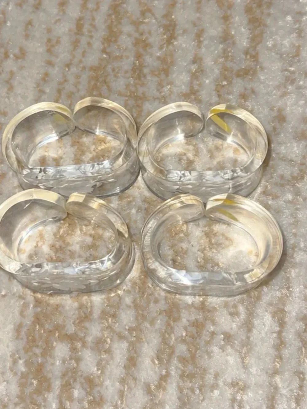 Vintage 4 engraved rose napkin holders. Good condition.